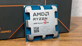 A photo of a Ryzen 7 8700G processor, with the number 8 crossed out and replaced with the number 9 for comedic effect.