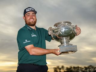 Dan Bradbury lifting the french open trophy after winning on the DP World Tour in 2024