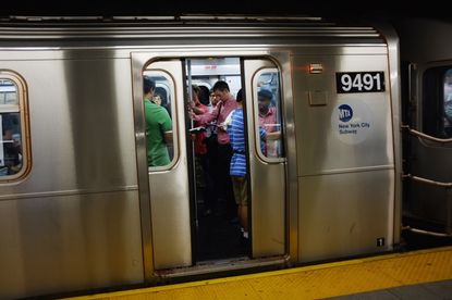 Riders aboard a New York City subway