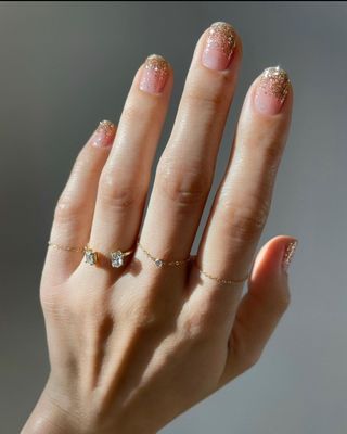 Shimmering gold manicure by Betina Goldstein