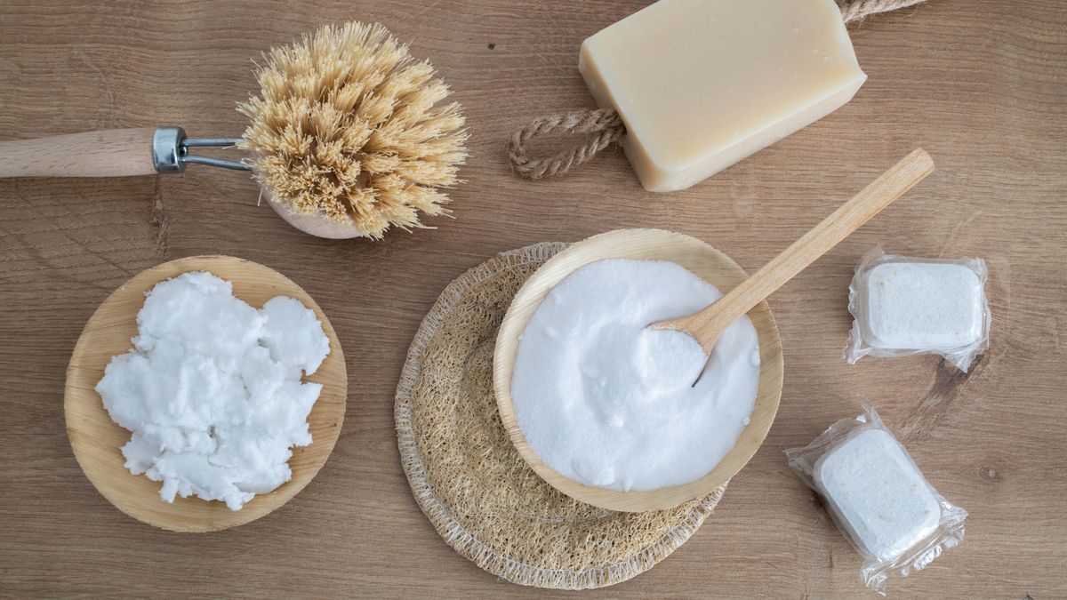 The ingredients to make homemade laundry detergent including soap, representing an article about how to make your own laundry detergent