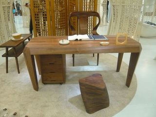 Desk with drawer unit, desk chair, and stool all made from walnut