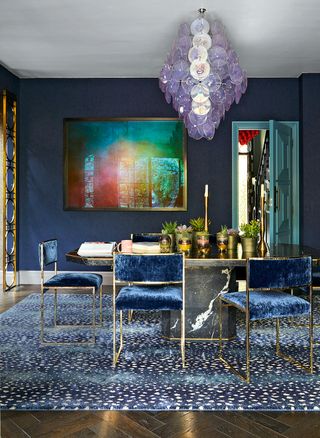 dark blue dining room with big purple chandelier