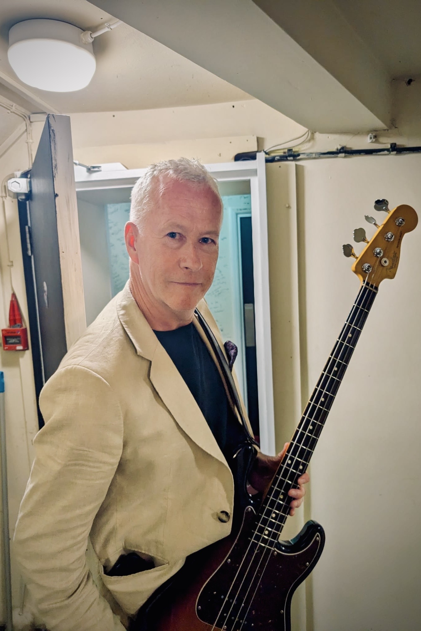 John Wilson with his bass guitar