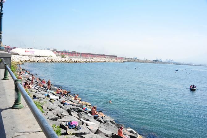 The pink banners can be seen from afar on the waterfront in Naples