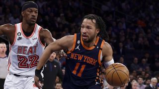 Jalen Brunson #11 of the New York Knicks in action against Jimmy Butler #22 of the Miami Heat in a Heat vs. Knicks live stream
