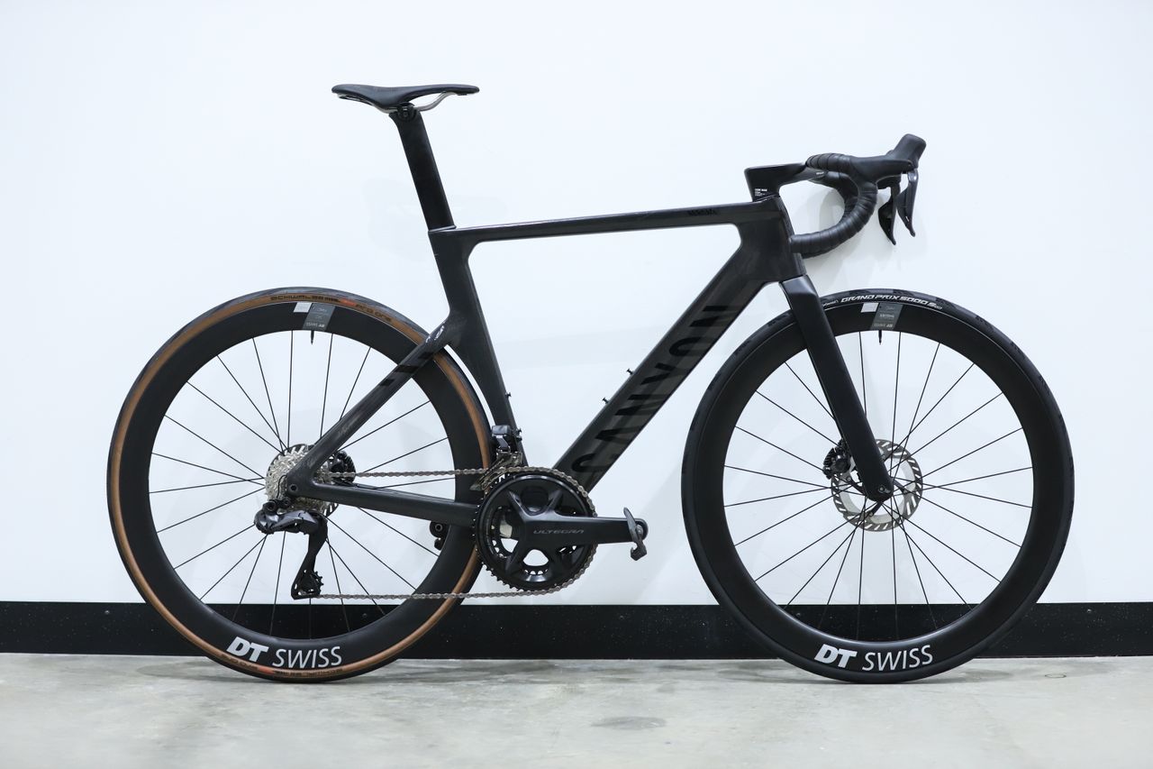 A Black Canyon Aeroad CFR stands against a white wall