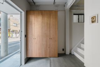 entrance joinery and stairs leading up inside House in Tamatsukuri