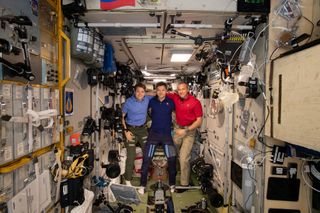 NASA astronaut Anne McClain, Roscosmos cosmonaut Oleg Kononenko and Canadian Space Agency astronaut David Saint-Jacques (right) will return to Earth from the International Space Station on June 24, 2019.