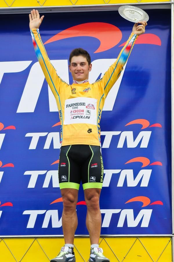Racer leader Andrea Guardini (Farnese Vini-Neri Sotttoli) on the podium.