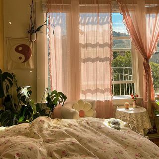 Light filtering pink drapes in relaxed boho bedroom