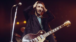 Pete Townshend of The Who performs live on stage at the Capitol Theater, Passaic, New Jersey on 10th September 1979. Townshend plays his Wine Red Gibson Les Paul Deluxe guitar number 1.