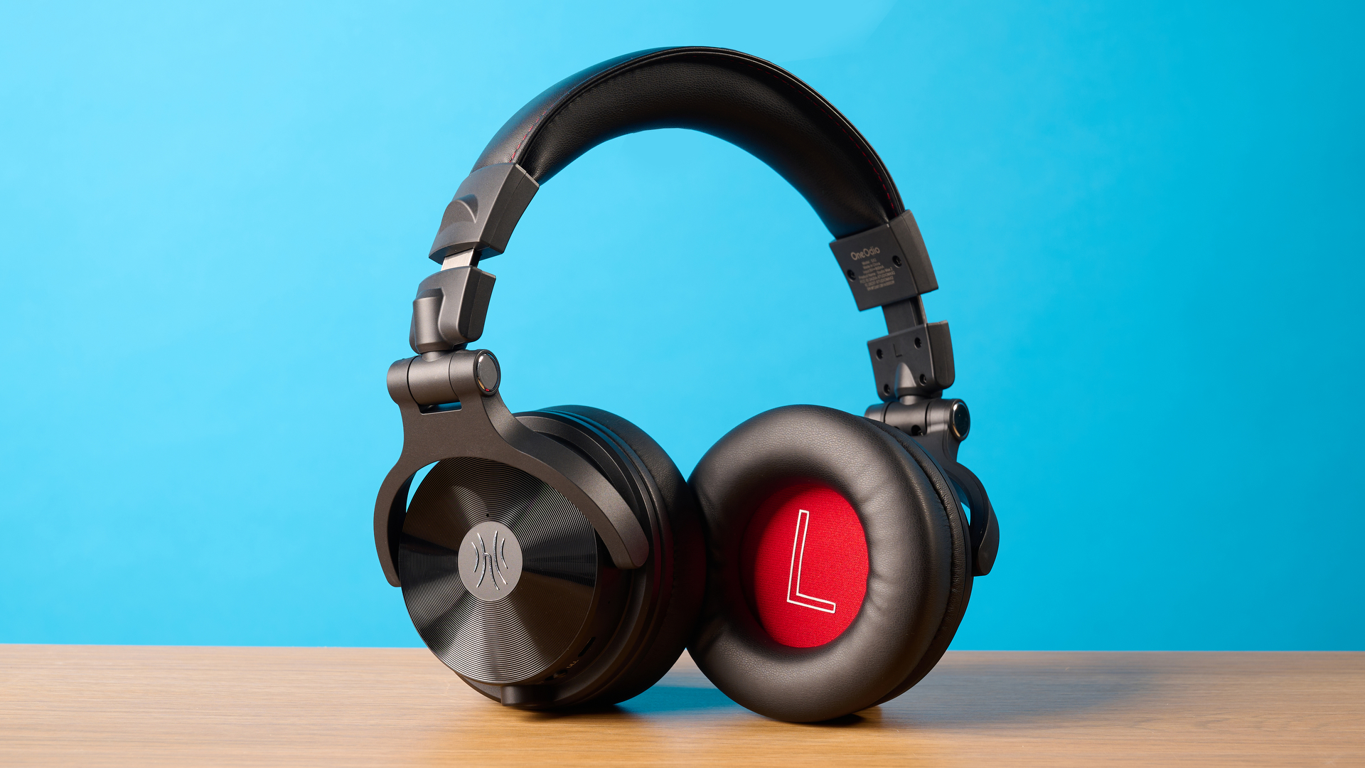 OneOdio Studio Max 2 in black photographed in front of a blue background