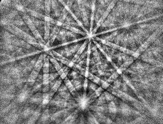An electron backscatter diffraction pattern from a nanometer sized area of the mineral zircon, like that which grew during the launch of the meteorite from Mars due to the cooling of melt pockets as it reached outer space. The researchers used this method of Electron Backscatter Diffraction (EBSD) to disentangle the sequence of Martian and launch events experienced by the meteorite.