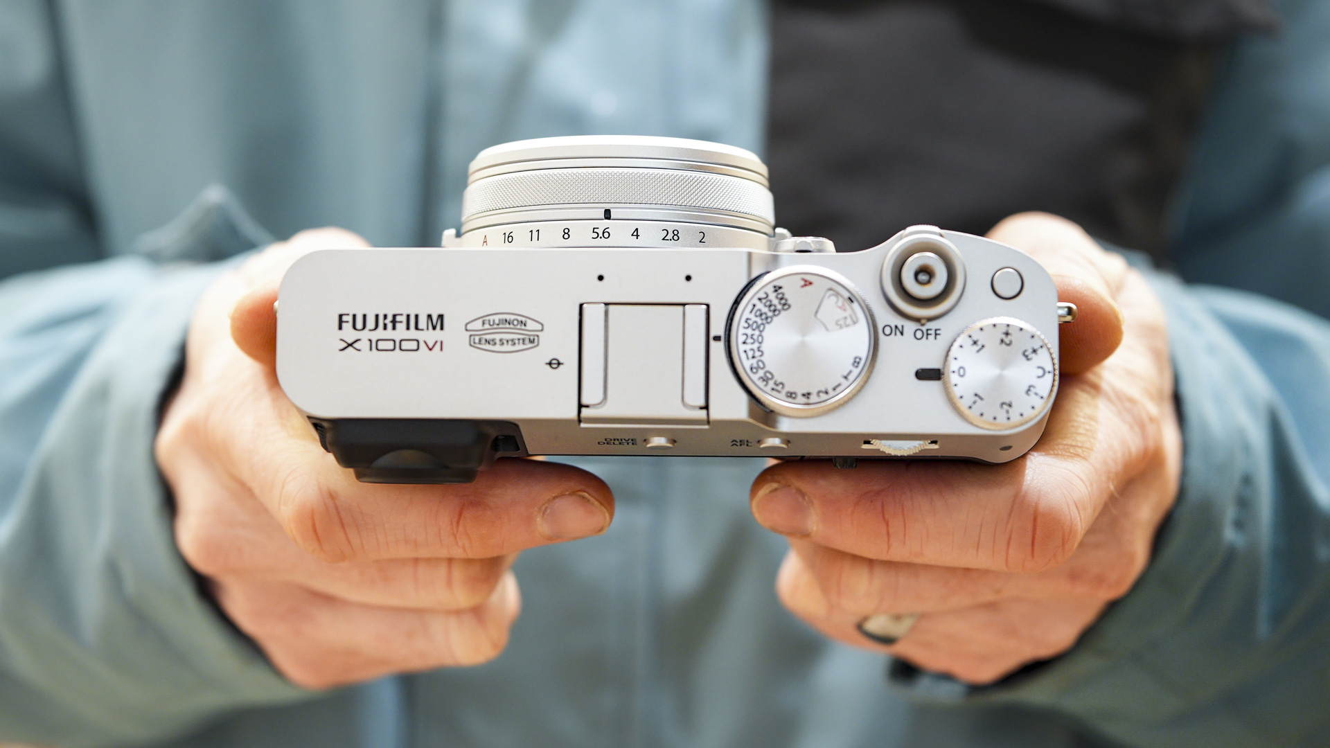 Fujifilm X100VI in the hand with top plate in view