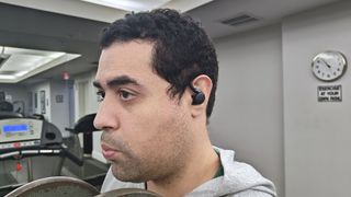 Our reviewer testing the Anker Soundcore Sport X20 in the gym