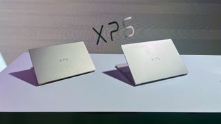 A Dell XPS 14 and Dell XPS 16 sitting on display