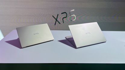 A Dell XPS 14 and Dell XPS 16 sitting on display