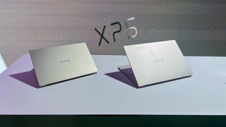 A Dell XPS 14 and Dell XPS 16 sitting on display