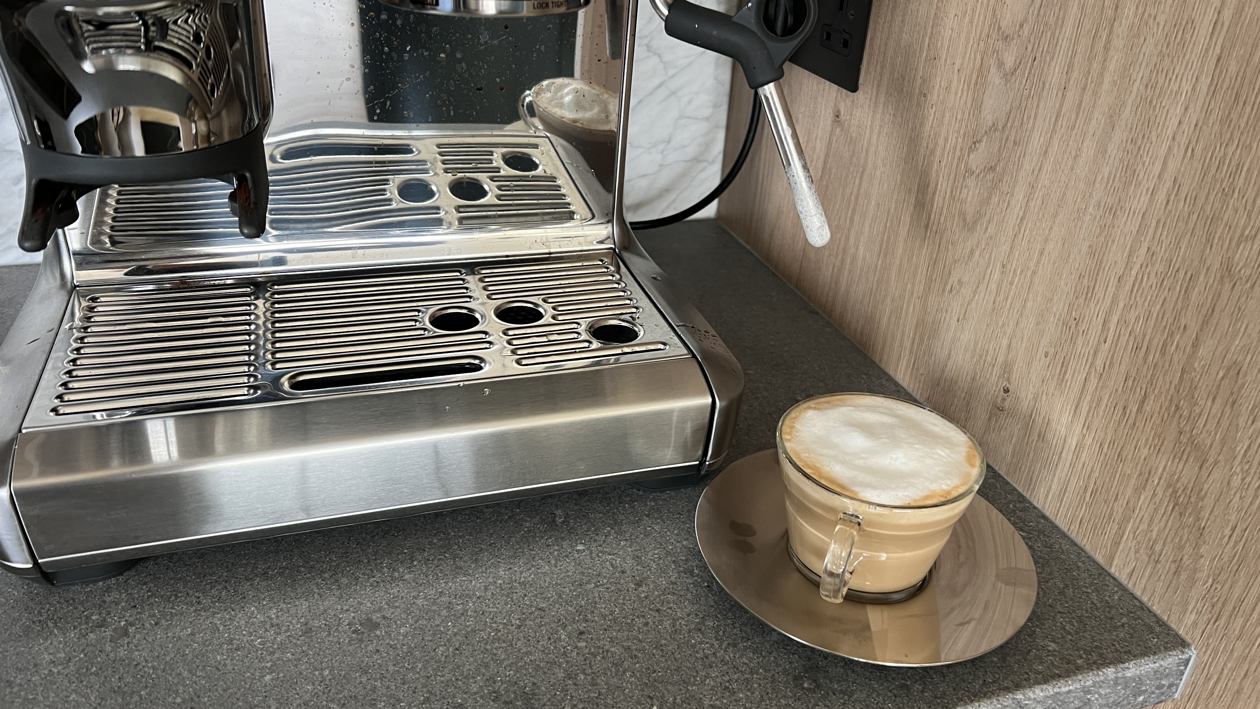 latte next to a coffee machine
