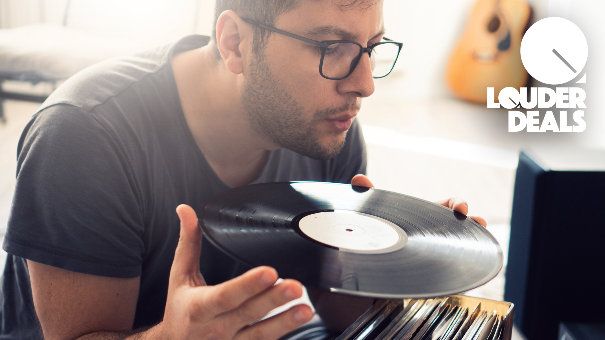 Man blowing on a vinyl record
