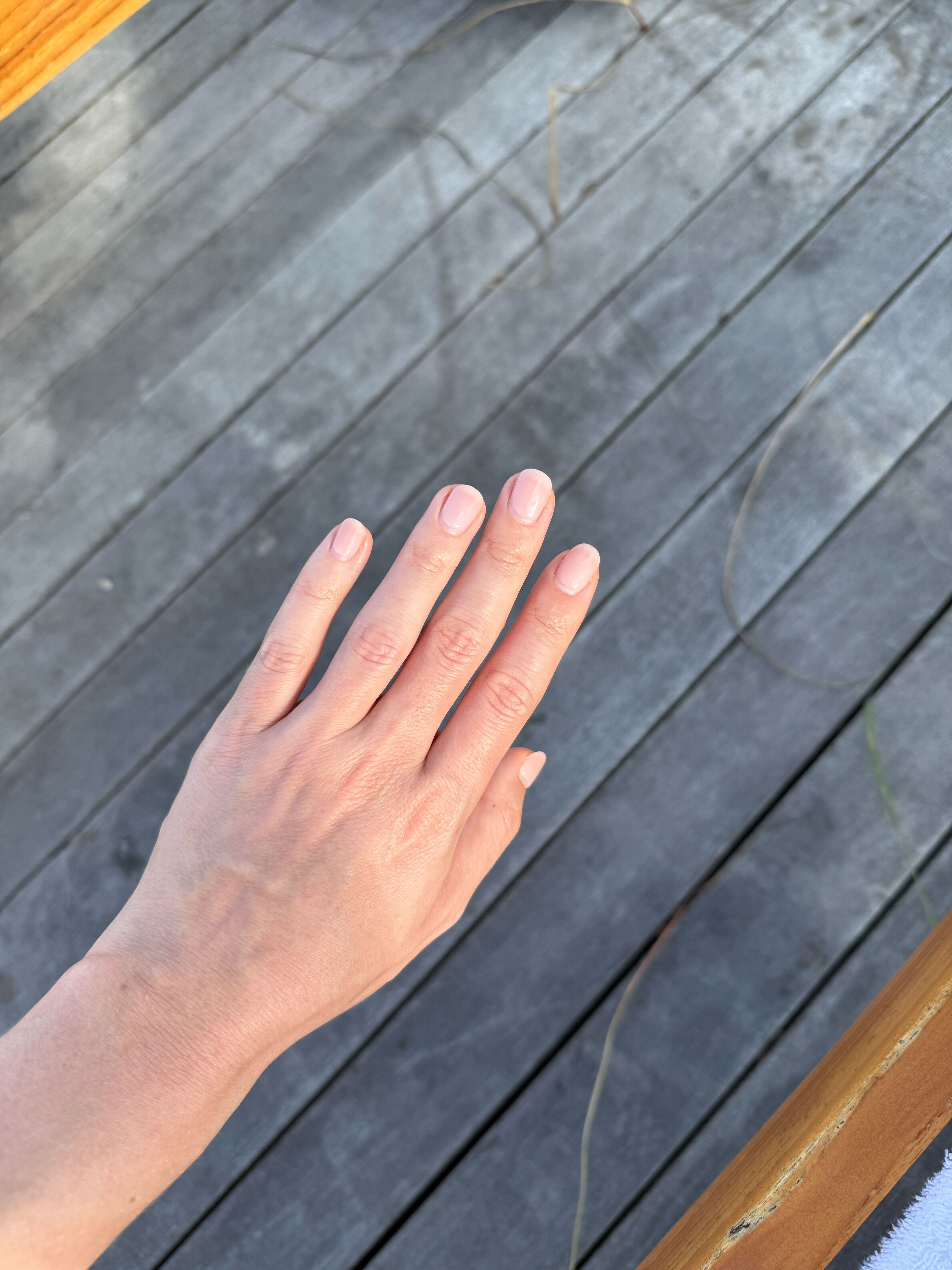 Photo of Jamie Schneider's nails three weeks after getting Japanese gel