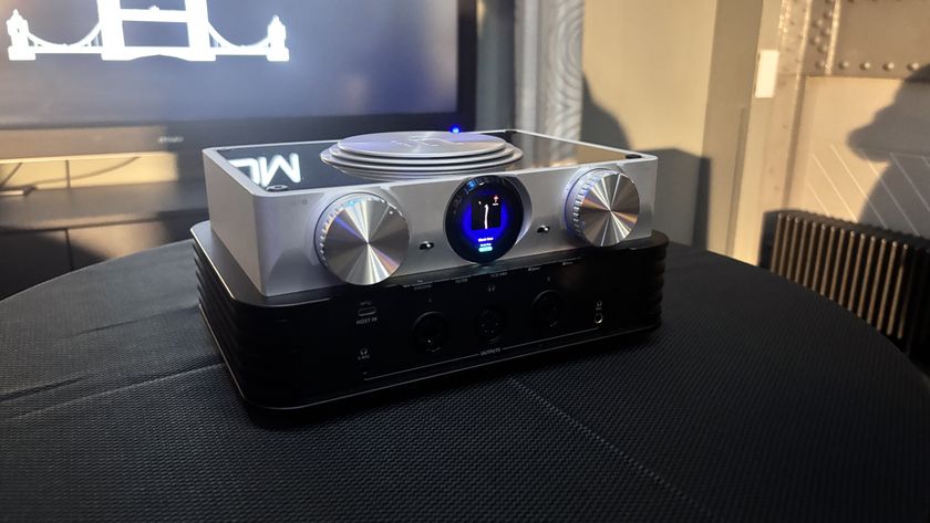 iFi Phantom music streamer on a black table in silver