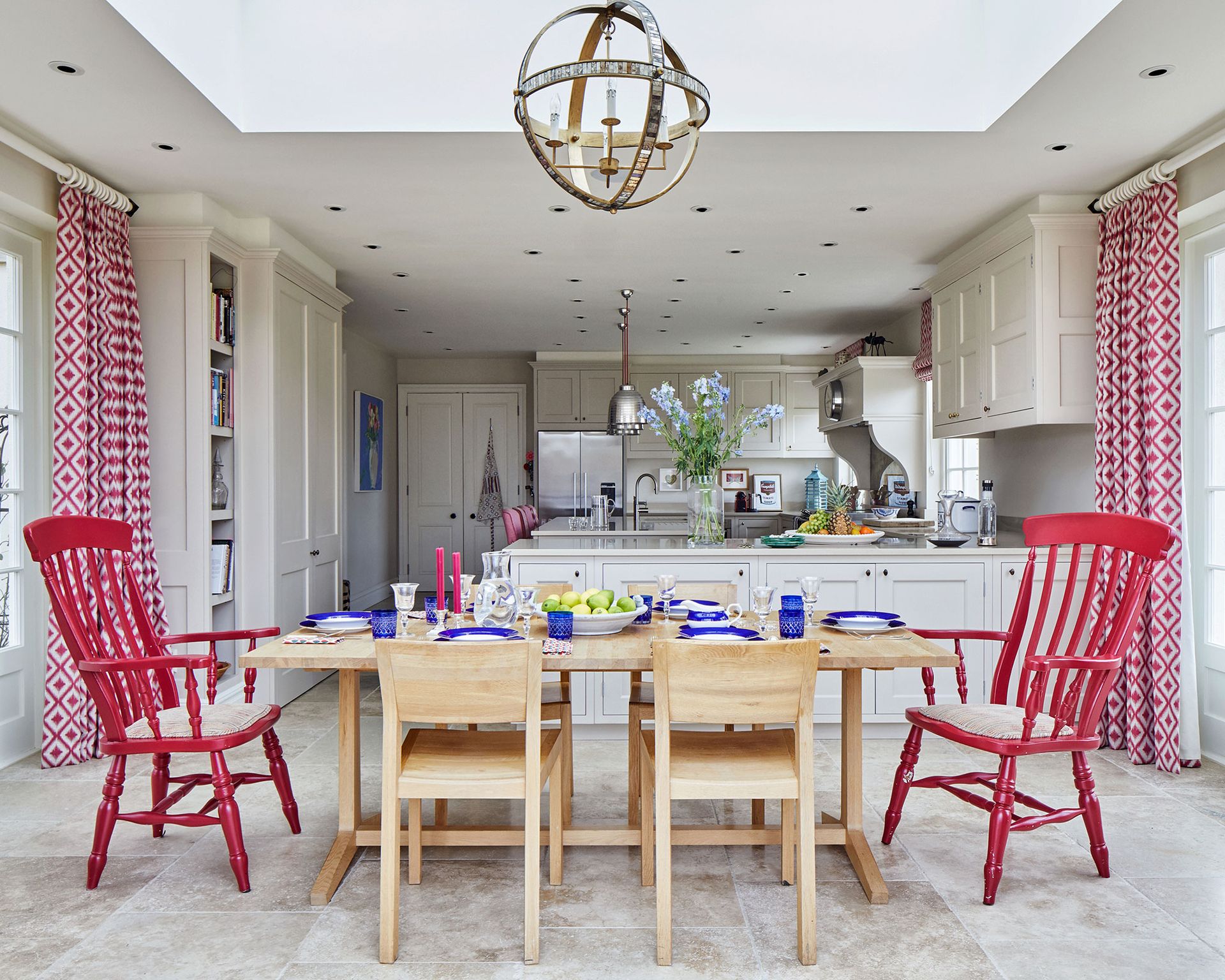 Dining room with colorful chairs and wooden table