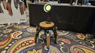 A photo of a robot that resembles a lamp