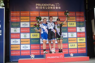 Kirsten Wild (NED) of Hitec Products Cycling Team (middle) celebrates her win with Nina Kessler (NED) of Lensworld Zannata Cycling Team (left) and Leah Kirchmann (CAN) (CAN) of Liv-Plantur Cycling Team (right) on the podium the Prudential RideLondon Classique