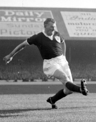 Former Scotland captain George Young in action
