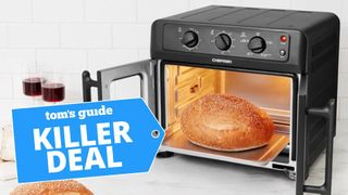 A photo of a loaf of bread being cooked in a Chefman French door air fryer oven