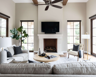 Neutral living room with warm elements and fireplace with colored tile