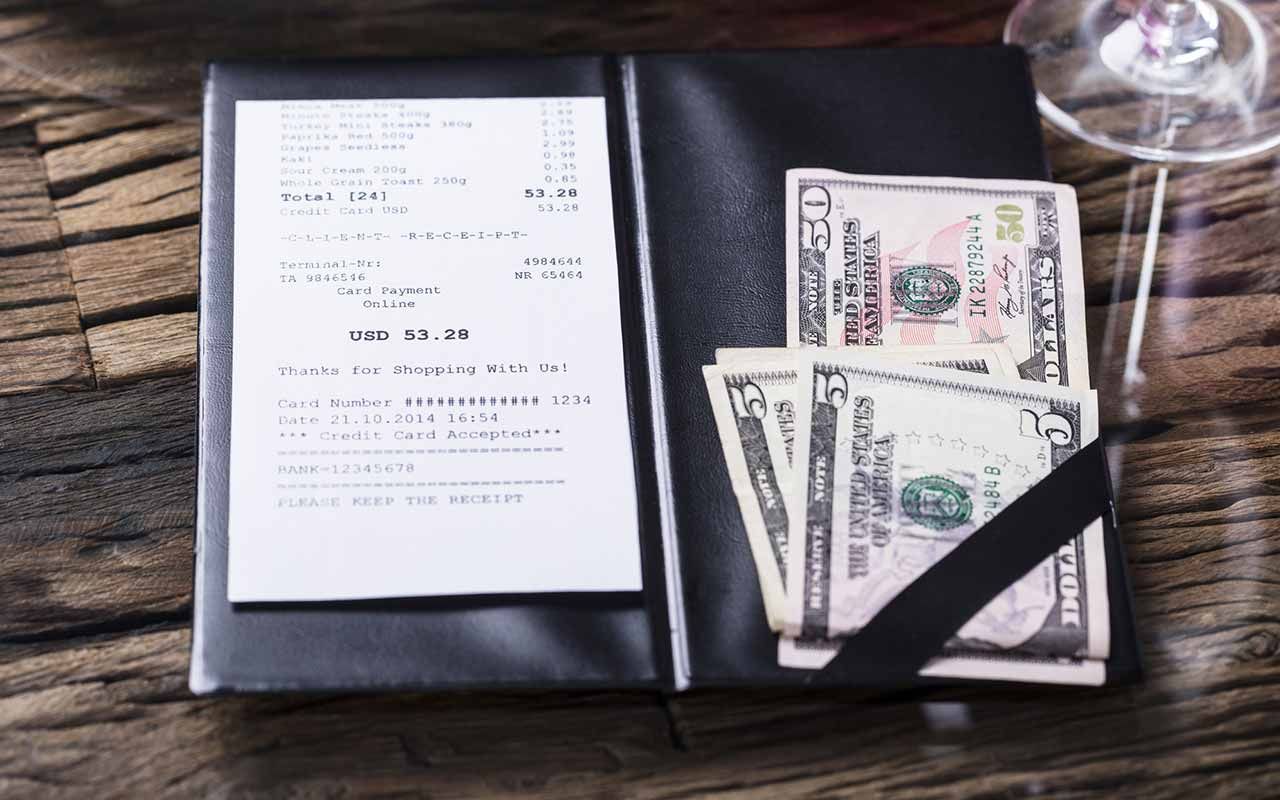 picture of a tip with a restaurant check