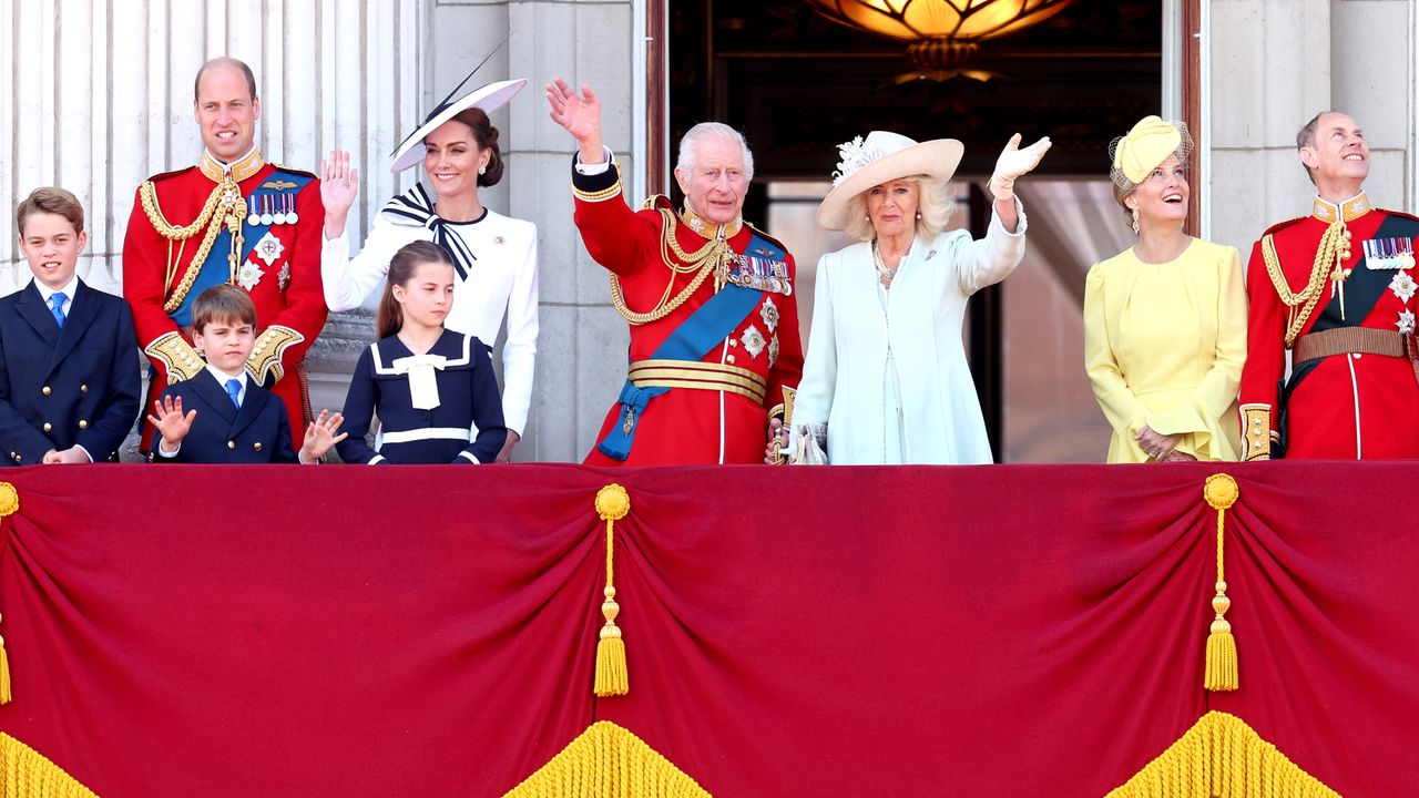 Members of the royal family including The King, Queen, Prince William and his family on the Buckingham Palace balcony smiling and waving during Trooping the Colour 