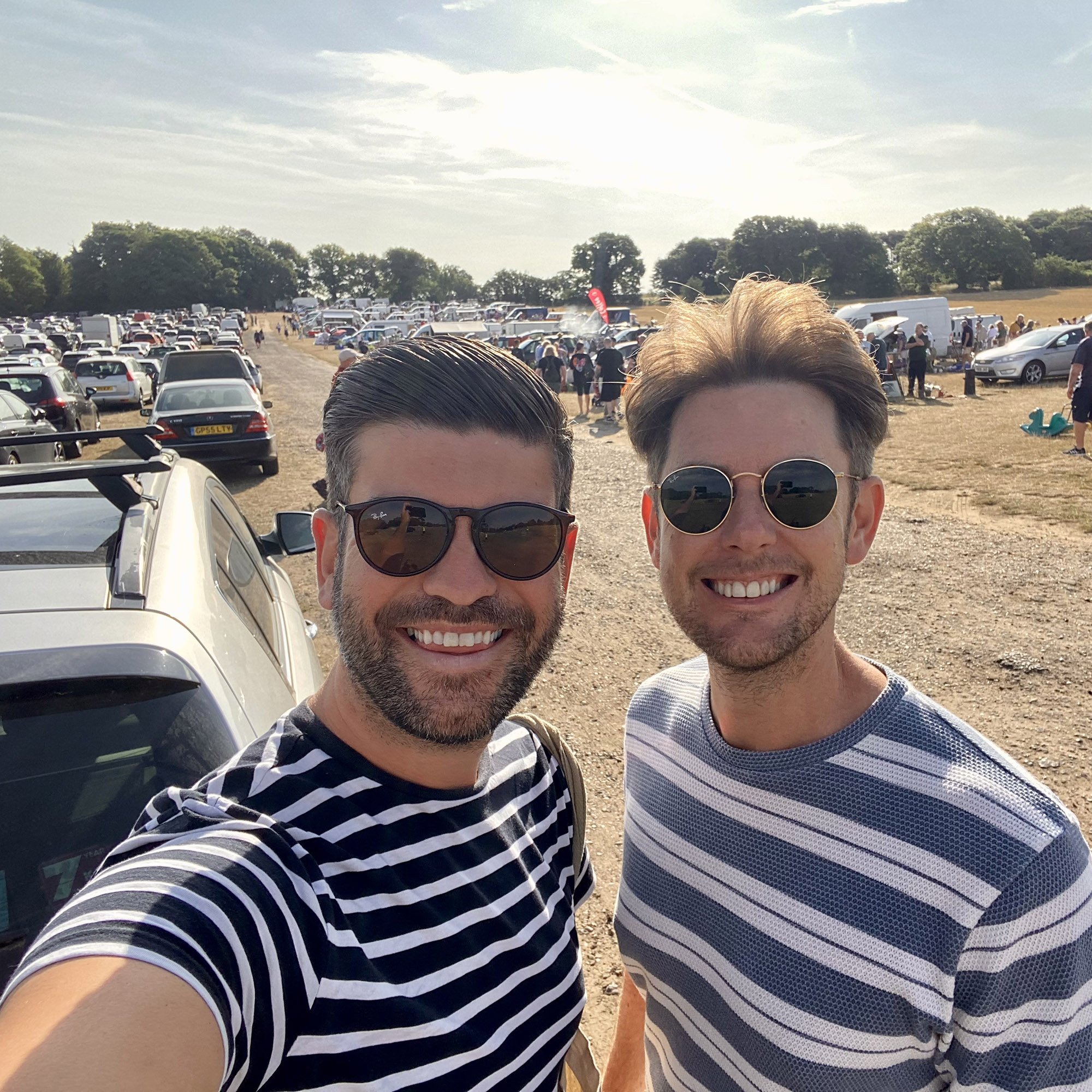 David and Andrew Harrison-Colley at a car boot sale in blue striped tops