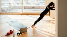 Woman performing a wall push up