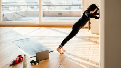 Woman performing a wall push up