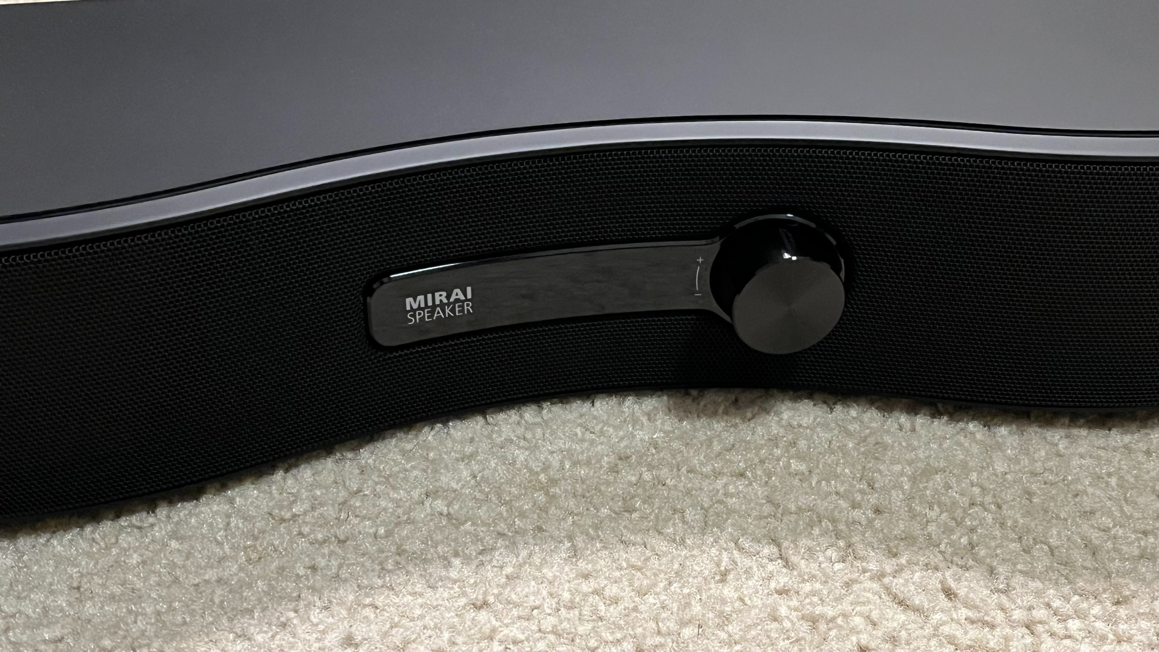 Soundfun Mirai soundbar on rug closeup of volume dial