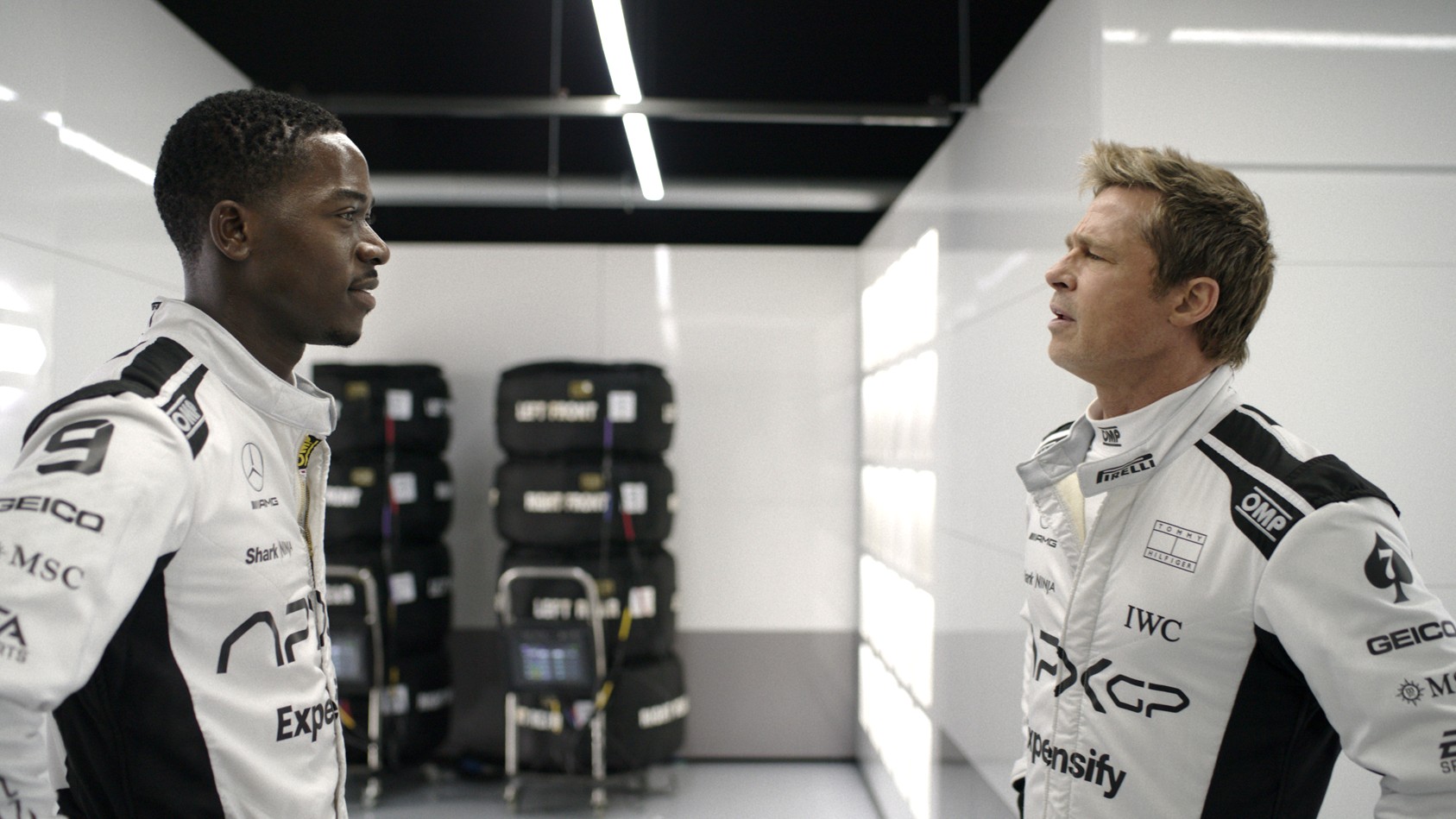L-R: Joshua Pearce (Damson Idris) and Sonny Hayes (Brad Pitt) mid-argument in a scene from "F1"