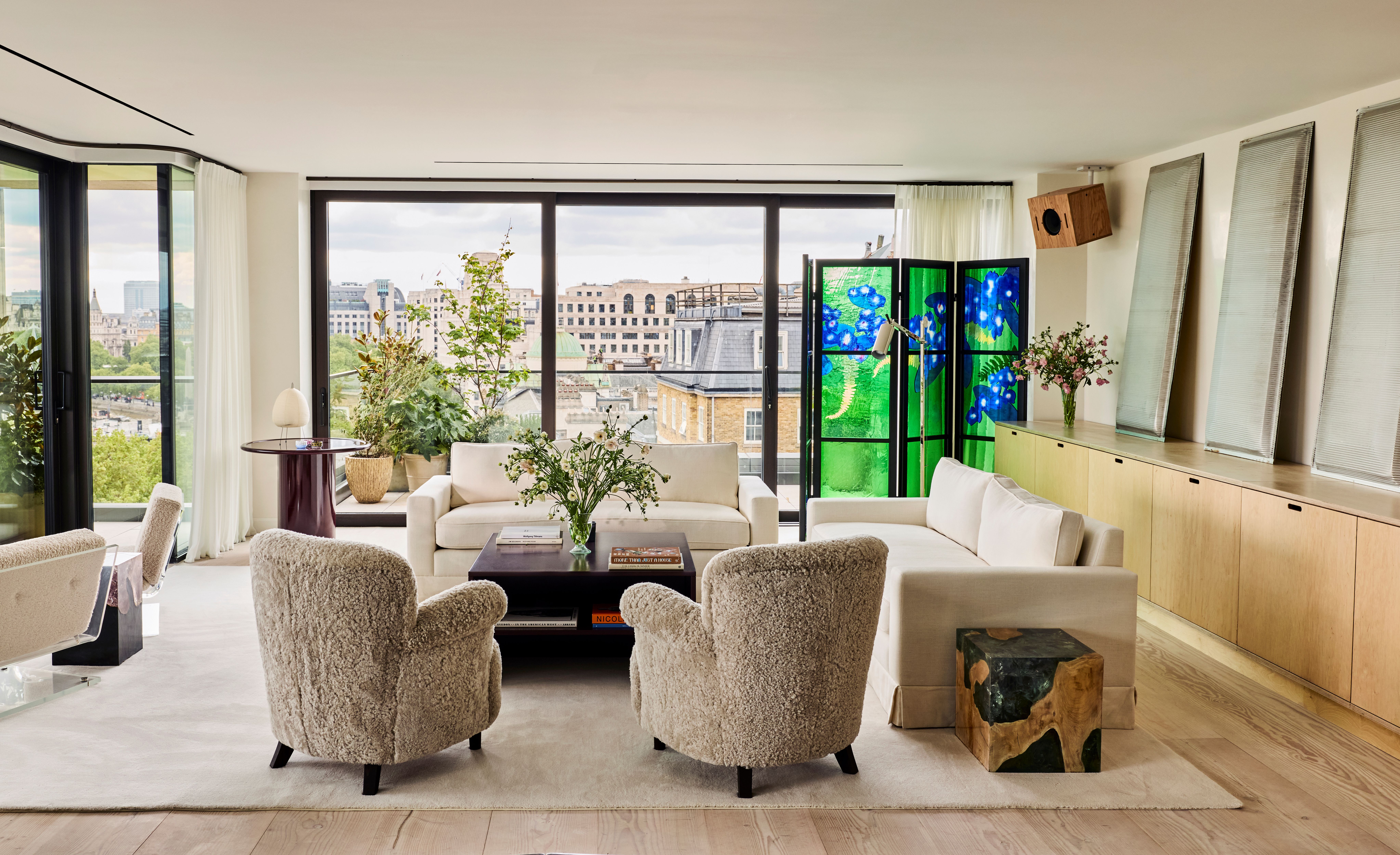 Double-height penthouse living room with panoramic Thames views and contemporary furnishings