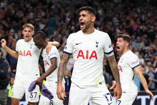 Cristian Romero celebrates with his Tottenham team-mates as Spurs beat Liverpool in added time in the Premier League in September 2023.