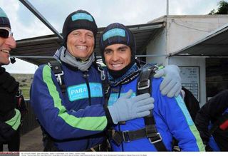 Bjarne Riis and Alberto Contador are all smiles after the jump