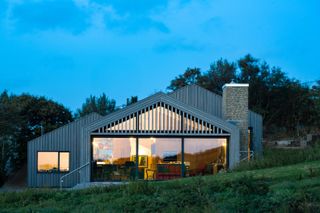 dusk view of Modern Barn by Coffey Architects