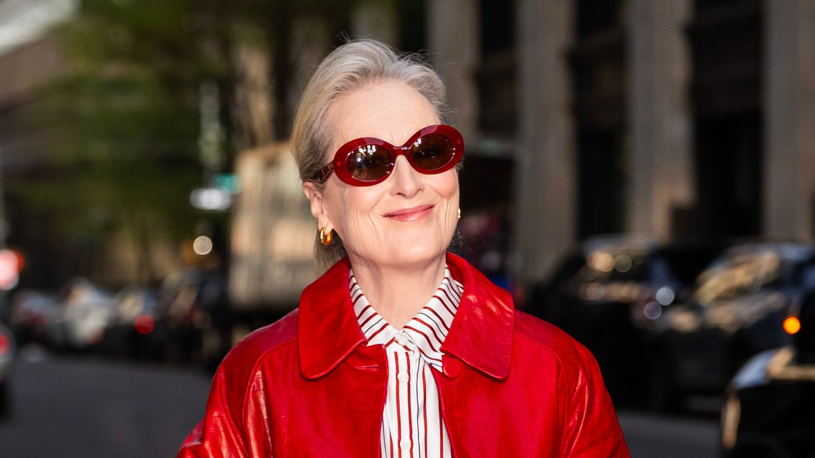 Meryl Streep in red sunnies and striped shirt