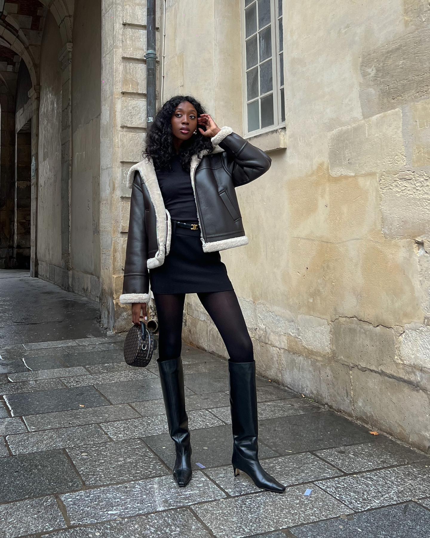Stylish women wearing mini dresses and knee high boots