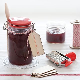 jams jars with stamped label and wooden spoon