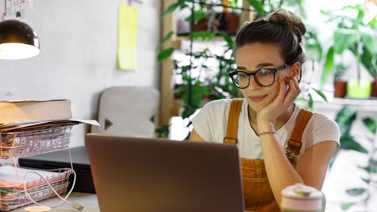 A young woman working in front of a computer