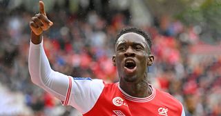 Arsenal star and Reims&#039; English forward Folarin Balogun celebrates scoring his team&#039;s first goal during the French L1 football match between Stade de Reims and AJ Auxerre at Stade Auguste-Delaune in Reims, northern France on October 23, 2022.