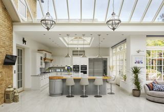 kitchen conservatory with glazed roof and sitting area